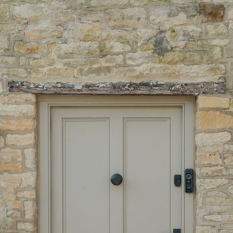 From The Anvil on Instagram: "On the front door of Bee's traditional thatched cottage, you’ll find our Aged Bronze lever lock set, matching letter plate & cover as well as our Beehive centre door knob 💫  The rich appearance of our Aged Bronze finish is a wonderful match for this taupe paint colour.   To discover our full range of Aged Bronze front door furniture, head to our website. . . . . #fromtheanvil #ironmongery #frontdoor #agedbronze #thatchedcottage #cottagecore #cottagestyle #cotswoldstone #cotswoldcottage" Cottage Doors Front Entrance, Taupe Doors, Beige Front Door, Bronze Front Door, Fromt Doors, Cottage Front Door, Front Door Furniture, Taupe Paint Colors, Cottage Front Doors