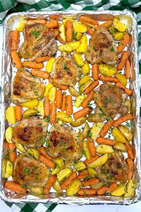 Craving an easy weeknight dinner that's packed with flavor? Look no further than Simple Sheet Pan Ranch Chicken with Potatoes and Carrots! This one-pan wonder is a dream come true for busy home cooks. Tender, juicy chicken roasts alongside crispy potatoes and sweet carrots, all coated in a crave-worthy ranch seasoning. Best part? Minimal prep and cleanup make this recipe a win-win. Get ready for a delicious and satisfying meal that the whole family will love. Chicken Potatoes Carrots Oven, Chicken And Roasted Carrots, Roasted Chicken With Potato And Carrots, Carrots Potatoes And Chicken, Chicken Potato Carrot Recipe, Chicken With Potatoes And Carrots, Ranch Chicken Thighs, Chicken Thighs With Potatoes, Factor Recipes