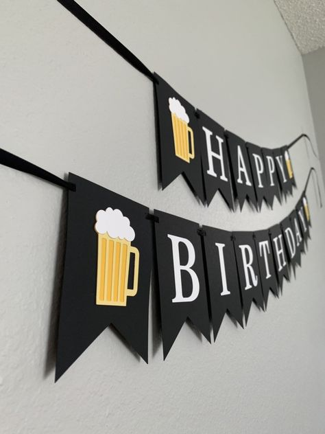 "This banner is perfect for a beer themed birthday party!! Details ** Made with layers of cardstock. ** Each pennant is 4\" wide x 5.6\" tall ** Letters are 3\" tall ** Choose from banner selections in drop down menu. ** If you choose to add a name, name will be added on a third string of ribbon (as pictured) ** Pennants are strung on black satin ribbon. ** If you would like different colors from the ones shown, please message me! Shipping ** All orders are made to order. ** For current turnarou Beer Birthday Decorations, Diy Happy Birthday Banner, Beer Themed Birthday Party, Happy Birthday Banner Diy, Beer Birthday Party, Beer Decor, 30th Birthday Banner, Happy Birthday Beer, 30th Birthday Ideas For Women