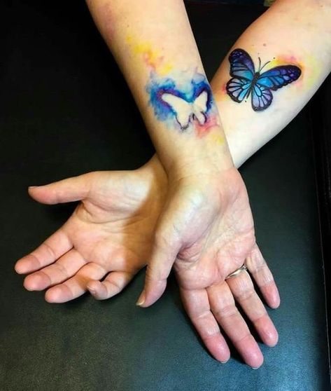 mother-daughter-tattoo-butterfly-watercolor-cutout-wrist-tattoos Tattoo Mother Daughter, Mommy Daughter Tattoos, Tattoos Mom, Tattoo Mother, Tattoos Architecture, Mom Daughter Tattoos, Tattoo Schrift, Daughter Tattoos, Парные Тату