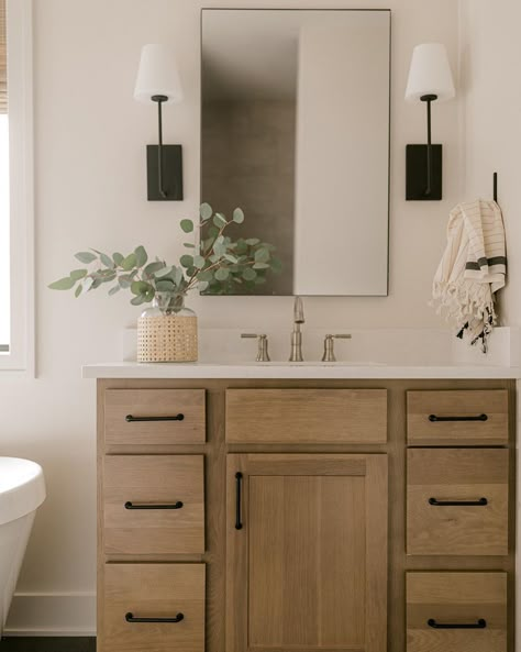 Bathroom With Black Finishes, Guest Bath Lighting, Birch Bathroom Vanity, Tan Vanity Bathroom, Tan Bathroom Vanity, Light Wood Vanity Bathroom, Bathroom With Black Vanity, Contemporary Half Bath, Birch Bathroom