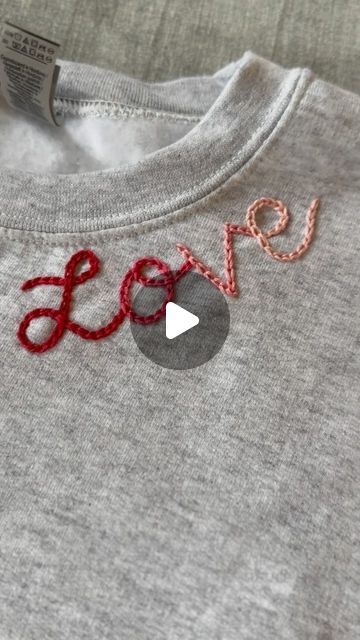 Diy Clothing Embroidery Courses | Hand Embroidery Kits on Instagram: "Happy #SIPsunday!  SIPsunday means Stitch in Progress Sunday and it’s a promise to spend at least 30 minutes a week on a fun embroidery project, sippin on something you love and enjoying some quiet me time!  This week I made a Valentine’s Day sweatshirt. I plan to add some hearts sometime this week, or maybe my boys names on the sleeve!   What are you stitching on this week? Also.. should I make this neckline love design a pattern?! Let me know🩷❣️  Looking to learn how to do this? Check out my page for more information about my beginner clothing embroidery course!" Sewing Embroidery Designs Free Pattern, Name Embroidery On Clothes, How To Do Embroidery, Embroidery Names Ideas, Name Embroidery Ideas, Embroidery Name Designs, Fun Embroidery, Clothing Embroidery, Boys Names