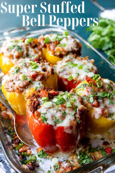 Fresh bell peppers are stuffed with a hearty mixture of ground beef, rice, pinto beans, tomatoes and taco spices. It is cooked up perfectly and topped with plenty of melted cheese! Domestic Skills, Easy Stuffed Bell Peppers, Stuffed Bell Peppers Ground Beef, Taco Spices, Pinto Beans And Rice, Mexican Entrees, Beans And Tomatoes, Ground Beef Rice, Beef Rice