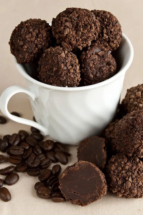 Dark chocolate truffles - coated in smashed coffee beans - fill a white coffee mug. There are stray truffles and coffee beans at the base of the mug. Coffee Truffles Recipe, Coffee Truffles, Nutella Coffee, Happy National Coffee Day, Chocolate Covered Coffee Beans, Chocolate Covered Espresso Beans, National Coffee Day, Coffee Day, Make Coffee