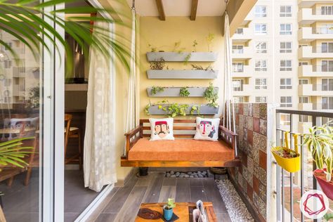 10 Comfortable Balcony Seating Ideas that Let you Lounge in Style Balcony Zula Design, Kitchen Balcony Ideas Indian, Swings For Balcony, Balcony Utility Ideas, Utility Balcony Ideas Indian, Jhoola In Balcony, Zula In Balcony, Flat Balcony Ideas, Balcony Swings