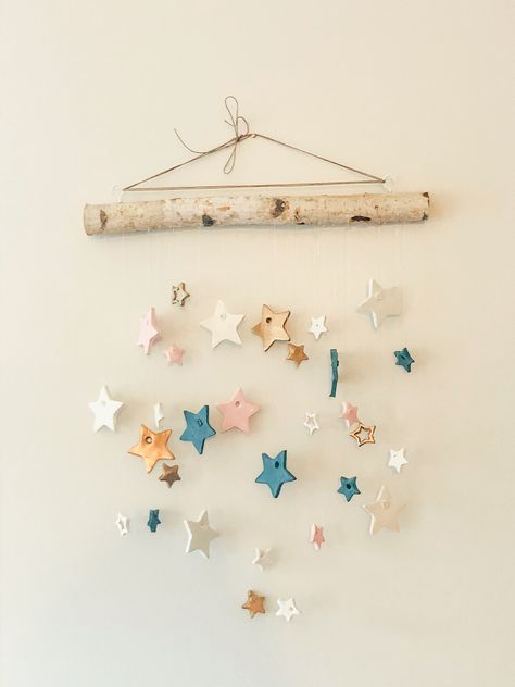 Christmas Crafts Nursery, Air Dry Clay Nursery Decor, Ceramic Hanging Decorations, Clay Mobile Diy, Polymer Clay Hanging Decorations, Clay Nursery Decor, Baby Clay Ideas, Air Dry Clay Stars, Air Dry Clay Hanging Decorations