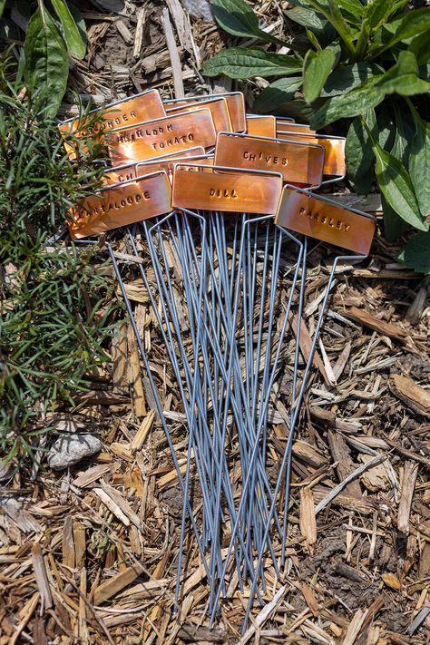 How to stamp copper plant markers with garden plant names. Metal Garden Markers, Stamped Plant Markers, Name Tags For Plants, Metal Plant Labels For Garden, Garden Plant Labels, Diy Plant Name Tags, Garden Stakes Ideas Plant Markers, Garden Markers Ideas, Plant Tags Diy Garden Markers