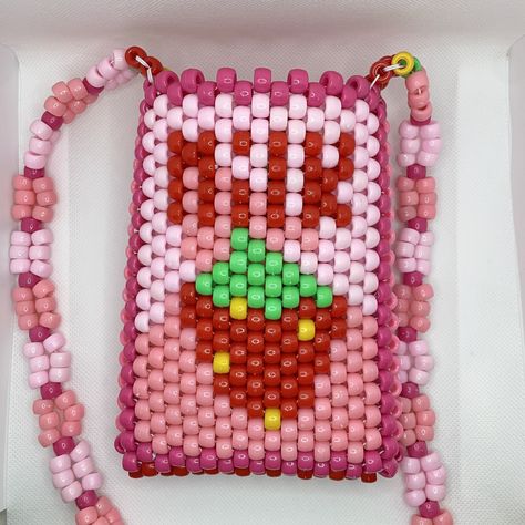 "Strawberry Milk carton crossbody Kandi purse is hand-made 100% from beads on ONE string. Just like you, all of the purses on my shop will always be 1/1.  DIMENSIONS: Bag - 6.5\" tall x 5\" wide  Strap - 48\" long  All items are hand-made on white jewelry string and triple-knotted to ensure the best stretch and durability. As a thank you, every order also includes FREE GIFTS! (Bigger orders = bigger gifts 😊)" Kandi Purse Tutorial, Pony Bead Bag, Kandi Wallet, Kandi Backpack, Kandi Bag Pattern, Kandi Purse, Kandi Bag, Strawberry Milk Carton, Rave Bracelets