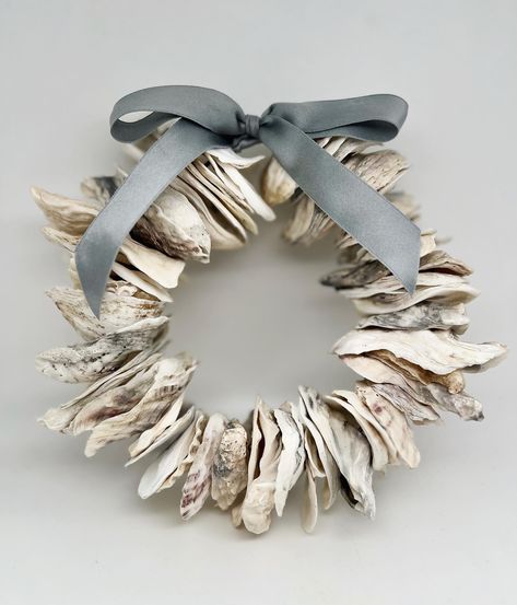 *Update: SOLD* Adding this back in the shop today!!! Get it quick, it will not last. This natural oyster wreath is 7” in diameter and is finished with a sea-grey silk charmeuse ribbon. https://littlesercies.etsy.com #oysterwreath #oystershells #beachywreath #coastaldecor #beachydecor #littlesercies #silkcharmeuse #riverhouse #beachhousedecor #coastalwreath #oystershellart #oystershelldecor #summerwreath #christmasoysterwreath #NCOysters #VAOysters Oyster Wreath, Oyster Shell Wreath, Oyster Decor, Oyster Shells Diy, Oyster Shells Decor, Coastal Wreath, Oyster Shell Crafts, Seashell Wreath, Shell Wreath