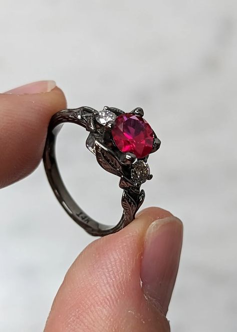 MAIN STONE
Type: Conflict Free Cultured Ruby
Cut: Round
Color: Red
Clarity: Eye-Clean (VS Clarity)

#Nature #Inspired #1ct #Round #Cut #Ruby #14K #Black #Gold #Engagement #Ring #Gothic #Leaves #Motif #Statement #Ring #Custom #Wedding #Ring #for #Her
#engagement #ring #wedding #ring #promise #ring #custom #ring #unique #rings #Lab #Ruby #Ring #round #ruby #ring #vintage #leaf #ring #gothic #ring #black #gold #ring #nature #inspired #ring #solitaire #ring #red #gemstone #ring Black Gold Engagement Ring, Engagement Ring Gothic, Black Gold Engagement Rings, Engagement Ring Types, Gothic Wedding Rings, Custom Wedding Ring, Nature Inspired Engagement Ring, Wedding Ring For Her, Custom Wedding Rings