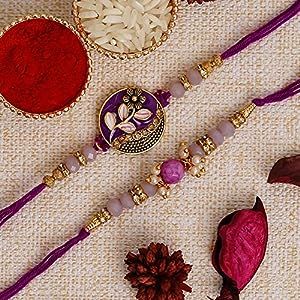 Package Content - 1 Purple Floral & Pearl Pack of 2 Desginer Rakhis, 1 Roli Chawal Pack Colour - Multicolor, Rakhi Type : Designer Rakhi, a unique accessory, symbolizes the unbreakable bond between siblings. Sisters tie this thread on their brothers' wrists, expressing love and protection. Rakhis come in various designs and colors, with each color holding its own significance. Red symbolizes love, while yellow represents happiness. Rakhi is a perfect celebration of the love, respect, and gratitu Rakhi For Brother, Purple Set, Expressing Love, Stylish Bracelet, Chocolate Box, Love Symbols, Accessories Unique, Purple Floral, Crafts To Sell