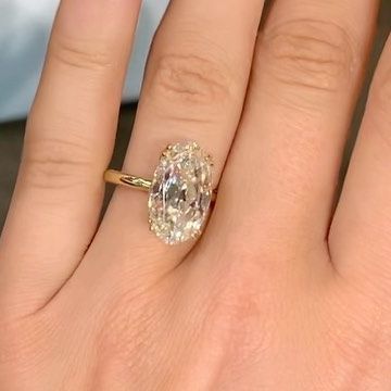 EAST WEST GEM CO. // on Instagram: "This 10 carat Old Mine Moval solitaire for under 5k is just 🤩 -————————— #EASTWESTHARPER - 10 carat center (1.72 ratio) - 15.5x9mm old mine moval cut, vintage white moissanite set in 18k yellow gold - “More metal” 1.8mm band, donut and spaced double claw prong upgrade - $4,700 (as shown) 🤚🏼 Shown on a size 4.5 finger 💍 This exact ring is available for try on in the Charleston showroom or can be purchased. Currently a size 5.25, can be resized between sizes Old Mine Moval Engagement Ring, East West Gem Co, Moval Engagement Ring, East West Oval Ring, Old Mine Cut Engagement Ring Moisenite, Old Mine Cut Engagement Ring Gold, Old Mine Cut Diamond Engagement Ring, Old Mine Cut Diamond Ring, Thick Gold Band