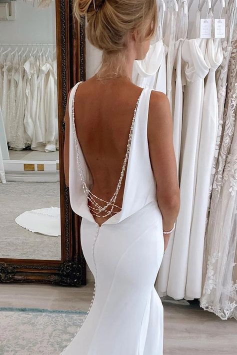 Embody wedded wonder in this backless mermaid wedding dress. The smooth satin fabric is cut to perfection, featuring a V-neck that gives way to a trail of delicate pearls down the back. The dress hugs the contours of your body, culminating in a sweeping train that adds a final note of grandeur to your wedding attire.You can choose a standard size or leave us custom size, for custom size, we need the following information in the order notes when you check out :Bust: ________inch/cmWaist: ________ Low Backless Wedding Dress, White Backless Wedding Dress, Satin Wedding Dress Fitted, Lavender Prom Dress Long, Backless Mermaid Wedding Dresses, Lavender Prom Dresses, Halter Evening Dress, 2 Piece Prom Dress, Wedding Veils Lace