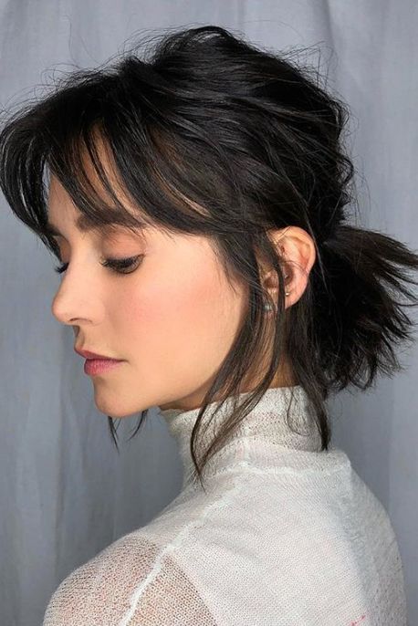 If you think short-haired ladies can’t pull off a stylish pony, think again. Let those layers and bangs roam free, and it’ll capture that undone look perfectly. #ponytailhairstyles #easyponytail #updo #southernliving Long Bob With Curtain Bangs Wavy Hair, Short Hair Ponytail, Short Ponytail, Short Hair Trends, Penteado Cabelo Curto, Short Hair With Bangs, Hair Color Trends, Short Hair Cuts For Women, Hairstyles Haircuts