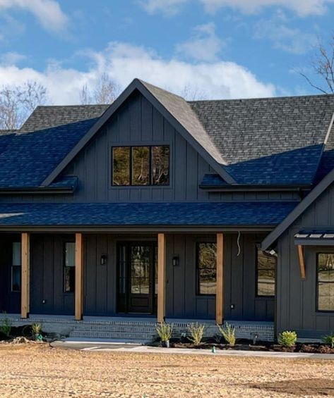 Here are the BEST modern black farmhouse designs to date! Black farmhouse exteriors and modern black farmhouses you will love. Black Ranch Style House Exterior, Tricorn Black House Exterior, Houses With Black Metal Roofs, Black House Exterior Wood Accents, Black Roof House Exterior, Black Siding Exterior, Black Craftsman House, Black And Cedar House Exterior, Black Modern Farmhouse Exterior