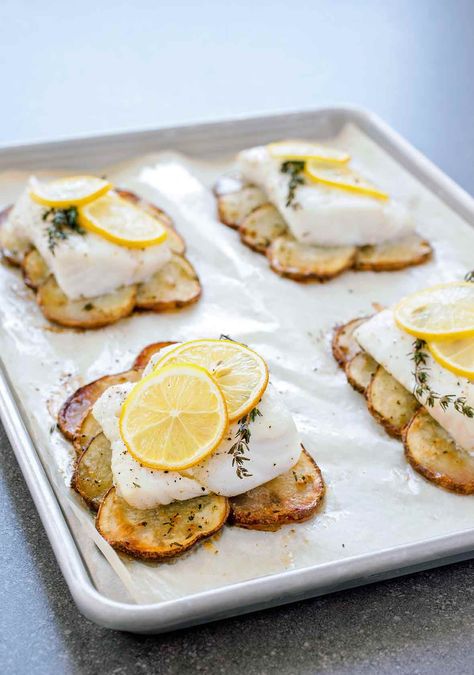 This elegant one-pan meal of lemon roast fish with potatoes is fancy enough for guests but completely doable on a weeknight. #weeknight #fishrecipes #onepan Fish With Potatoes, Roasted Cod, Roast Fish, Lemon Herb, Edamame, Fish Dishes, Seafood Dishes, Fish And Seafood, Fish Recipes