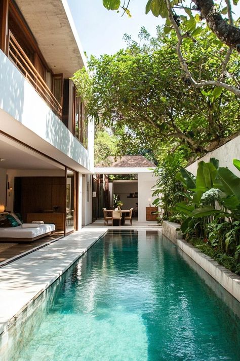 Modern house with a compact pool along the wall tree lined garden. Check out all of these creative small pools in modern homes, transforming limited space into a relaxing oasis. Pool Small Yard, Narrow Patio Ideas, Narrow Pool, Creative Houses, Outdoor Corridor, Poolside Loungers, Sustainable House Design, Simple Pool, Modern Residential Architecture