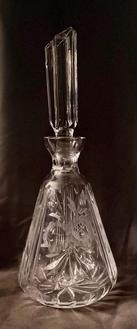 Introducing a vintage etched glass wine decanter that promises to add a unique touch to your collection. This decanter is perfect for anyone who loves to entertain, and features a clear glass body with intricate etchings. The decanter stands at 12 inches tall and comes with an original lid/stopper that is unlike any other. Unfortunately there are some small chips to the stopper, please see photos before purchasing. Made of high-quality glass material, this vintage decanter is a must-have for col Victorian Glassware, Paterson Nj, Vintage Decanter, Wine Enthusiast, Etched Glass, Decanters, Glass Etching, Wine Decanter, Glass Material