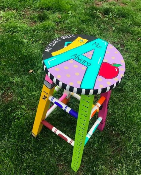 Jodi : Classroom Organization on Instagram: “A customized stool personalizes any classroom - How fun! This image was posted by Sydney from @hooray4teaching - Thanks for sharing this…” Teacher Stools Painted Diy, Painted Teacher Stool, Classroom Rocking Chair, Teacher Rocking Chairs, Teacher Stool, Teacher Stools, Homeschool Classroom Decor, Hand Painted Stools, Classroom Stools