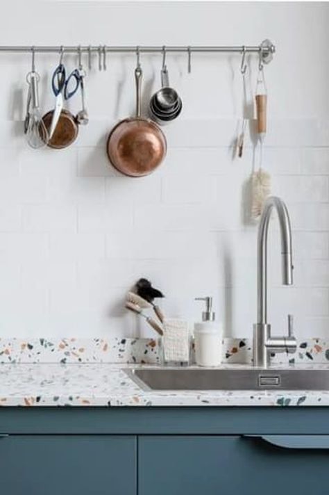 A white terrazzo countertop adds a playful touch to a dark blue kitchen Terrazo Kitchen Countertop, Terrazo Kitchen Benchtop, White Terrazzo Countertop, Grey Terrazzo Kitchen, Terrazzo Countertop Kitchen, Light Grey Countertops, Terrazzo Kitchen Countertops, Kitchen Terrazzo, Dark Blue Kitchen