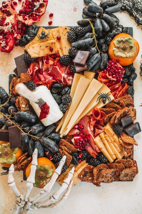 Say hello to spooky with this Halloween charcuterie board! This fun halloween appetizer is perfect when you want something that is equally edible as it is festive. This meat and cheese board is made with strategic regular ingredients with Halloween themed food in mind, I mean, who doesn't love a bleeding jam goat cheese?! A huge thank you to Roth Cheese for sponsoring this post! Spooky Charcuterie, Fun Halloween Appetizers, Halloween Backen, Halloween Appetizer, Snack Boards, Halloween Charcuterie Board, Halloween Charcuterie, Charcuterie Ideas, Halloween Themed Food