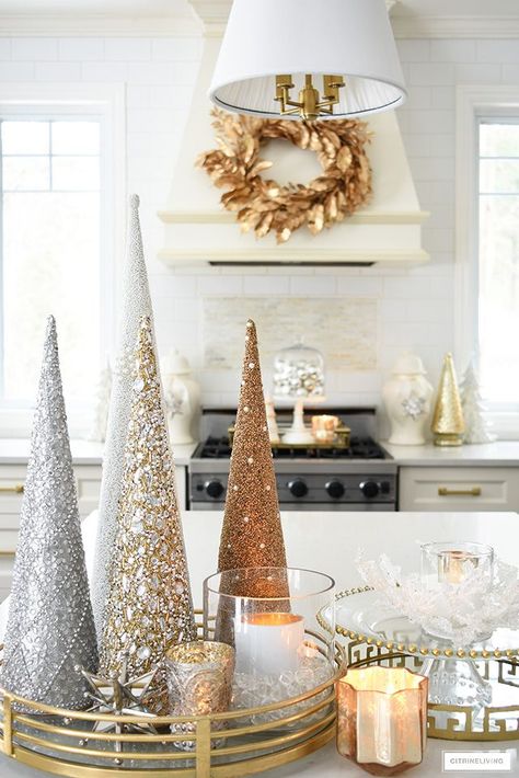 Elegant Christmas kitchen decorating with gold, silver and white. Glittery tress on a brass tray is the perfect touch on the kitchen island! #christmasdecor #christmasdecorating #christmaskitchen #christmasideas #christmastrees #holidaydecorating Silver Gold Christmas, Glam Christmas Decor, Christmas Cones, Silver Christmas Decorations, Elegant Christmas Decor, Rose Gold Christmas, Glam Christmas, Cone Christmas Trees, Pink Christmas Decorations