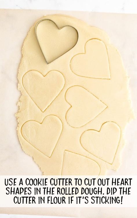 valentine sugar cookies process shot of valentine sugar cookies dough being cut Valentines Sugar Cookies, Cookies Dough, Valentine Sugar Cookies, Heart Shaped Valentines, Pink Frosting, Sugar Cookie Frosting, Buttery Cookies, Sugar Cookie Dough, Valentine Cookies