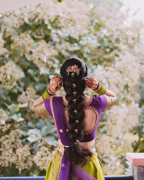 Enchanting bride in a vibrant purple and green saree, adorned with a beautifully embellished braid! Purple Half Saree, Saree Bride, Purple Saree, Half Saree Designs, Green Saree, Vibrant Purple, Purple And Green, Kurta Designs, Half Saree