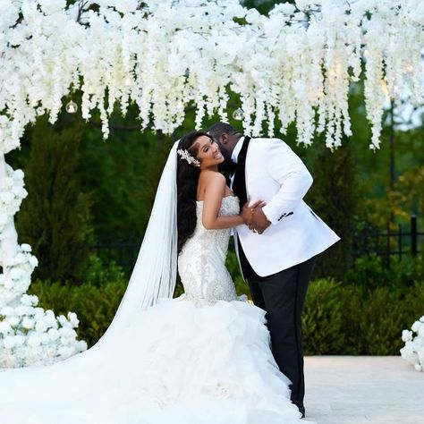 Tie the knot in an excellent style that speaks volumes – our bespoke tuxedos are the perfect match for your unique love tale, crafted for your ultimate ‘I do’ moment.  Got a friend planning a wedding? Please share this post to them.  Bride: @i_heart_magne_attraction Photo: @flemingsphotography Venue: @crystalballroomcharlotte Bride Mua: @classbychass Bride Hair: @beautifullifestyless Dress: @eseazenabor  #GC365 #customattire #groomtux #groomfashion #wedingvibes #groom2024 #suitupinstyle White Suit For Groom, Groom Tux, Black And White Suit, Bride Hair, Tie The Knot, Groom Suit, Planning A Wedding, Tuxedos, Groom Style