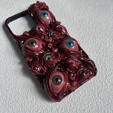 PRICES MAY VARY. Horror Phone Case: The phone case case is covered with 3D evil eyes, teeth, blood, which is cool and scary. Handcrafted: Each phone case is handmade, you will receive an exclusive phone cover. Wide Compatibility: Compatible with iPhone 15 Pro Max, iPhone 13 Pro Max, 14, 11, 12 mini, X, Xr, 8 Plus, etc. and most Samsung Galaxy models. Unique Gift: The horror phone case is super stylish, it could be an ideal gift for the one who like horror movies and love creepy elements. Reliabl Eye Phone Case, Samsung Galaxy Z Flip 5, Pretend Play Kitchen, Galaxy Z Flip 5, Z Flip 5, Google Pixel Case, Samsung Galaxy Z Flip, Creepy Halloween, Game Dresses