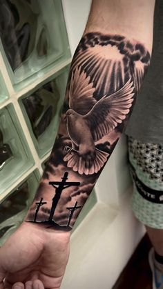 Three Crosses Sleeve Tattoo, Wrist Tattoos Men Sleeve, Angel With Dove Tattoo, Cross Crown Tattoo, Back Tattoo Christian, Memorial Hand Tattoos, Dove Sleeve Tattoo, Religous Tattoo Arm Sleeve, Religious Forearm Tattoo