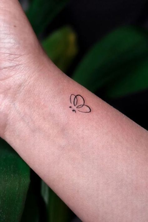 16 unique semicolon tattoos with meaning. Find small, butterfly, and more semicolon tattoo designs. #semicolontattoo #tattoomeaning . #Angel_Semi_Colon #Simple_Music_Note_Tattoo #Semi_Colon_Small_Tattoo_Ideas #Small_Wrist_Tattoos_For_Women_Meaningful Simplistic Semi Colon Tattoos, Angel Semi Colon, Dolphin Semicolon Tattoo, Cute Tattoos With Meaning Small, Small Simple Tattoos With Meaning, Small Semicolon Tattoo, Graduation Preparation, Tattoo Ideas Semicolon, Butterfly Semicolon Tattoo