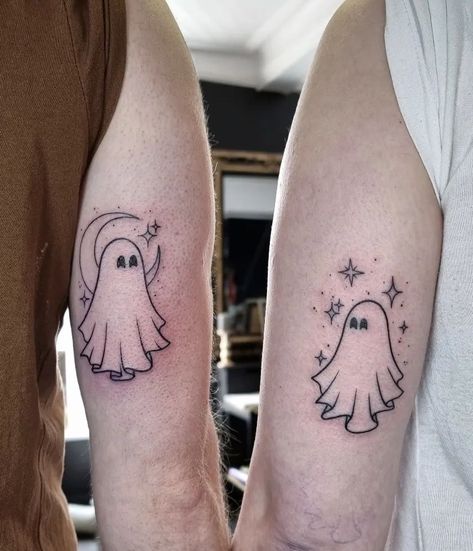 Ethereal Elegance: 11 Ghost Tattoo Ideas for a Hauntingly Beautiful Look Halloween Sibling Tattoos, Halloween Tattoo Ideas Matching, Best Friend Halloween Tattoo, Ghost Ankle Tattoo, 2 Ghosts Tattoo, Ghost And Bat Tattoo, Couple Halloween Tattoos, Matching Ghost Tattoos For Couples, Ghost Friend Tattoos