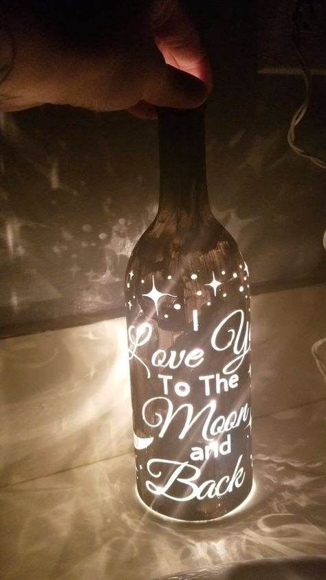 DIY Wine Bottle Light Tutorial! You can use these for wedding decor, home decor, or any special occasion. Check out my tutorial video on how to make this beautiful wine bottle light. Creative Lights, Diy Wine Bottle, Wine Bottle Project, Wine Bottle Light, Old Wine Bottles, Painted Bottles, Light Up Bottles, Bottle Diy, Decor Lights