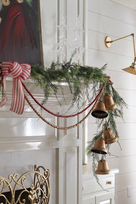 Bells In Garland, Sleigh Bell Decorating Ideas, Giant Christmas Bells Decorations, Vintage Bells Decor, Vintage Christmas Bells Decorations, Oversized Christmas Bells, Hanging Bells Decoration Christmas Decor, Decorating With Sleigh Bells, Holiday Bells Decor