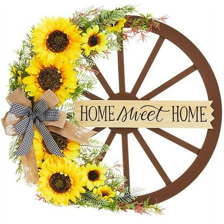 Wagon Wheel Wreath is an exquisite finishing touch for your farmhouse decor or country decorations. It will look perfect on any wall or over the fireplace. High-quality fabric flowers give it a natural look that rivals more expensive wreaths. Arrives ready to hang. Made of: MDF and polyester Measurements: 20-1/2"W x 18"L Color: Brown. Wagon Wheel Wreath, Harvest Porches, Country Decorations, Wheel Wreath, Fall Floral Decor, Artificial Christmas Garland, Country Wreaths, Plaid Decor, Wreath Hanger