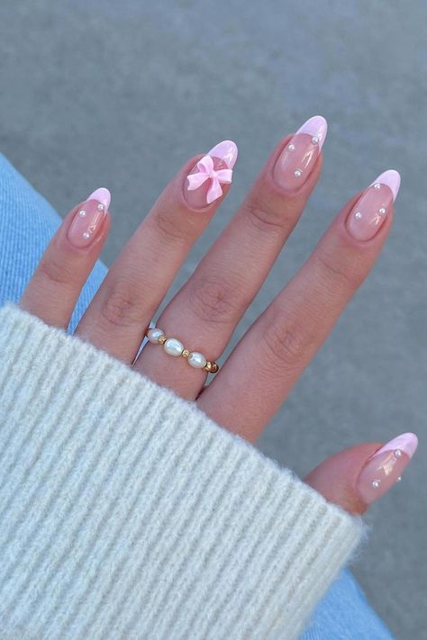 Step into elegant sophistication with these Baby Pink Stiletto Nails adorned with pearls and an adorable bow detail. Click through to explore the entire collection filled with understated chic designs that will add a feminine flair to your style ✨🎀 // Photo Credit: Instagram @naileditbeauty Baby Pink Stiletto Nails, Coquette Nail Designs, Coquette Nail, Pink Stiletto Nails, Coquette Nails, Baby Pink Nails, Cute Coquette, Punk Nails, Romantic Nails