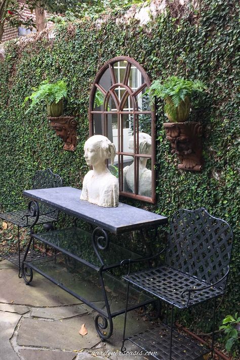 Secret garden decorations including an outdoor mirror, console table, statue and wall sconces Table Statue, Garden Escape, Charleston Gardens, Garden Nails, Outdoor Console Table, Tattoo Plant, Backyard Shade, Backyard Plan, Backyard Greenhouse