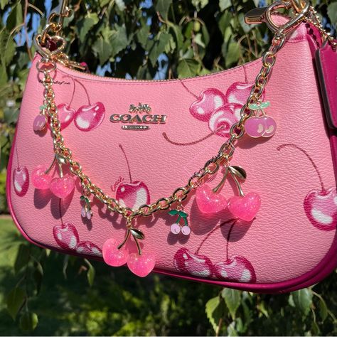 My Personal Favorite Cherry Charm Chain! You Will Receive One(1)- Hot Pink Heart Cherry Bag Charm Chain Hot Pink & Gold Glitter Big Resin Cherry Charms Pink Glitter Cherry Charms Baby Pink Cherry Charms Gold Heart Clips -Big Enough To Clip Right Onto Nearly Any Bag Hardware! Includes 2 Baby Pink Ball Chains To Hang The Chain From Bags With No Hardware To Clip Onto! Arrives In A Gift Box 13.75” Long As Made Famous By My Cherry Coach Bag Tiktoks! Intended As As A Decorative Swag Or Necklace/Bracel Cute Coach Bag, Cherry Coach Bag, Coach Bag Charm, Coach Cherry Bag, Coach Heart Bag, Pink Designer Bags, Cherry Bag, Hot Pink Heart, Cherry Charm