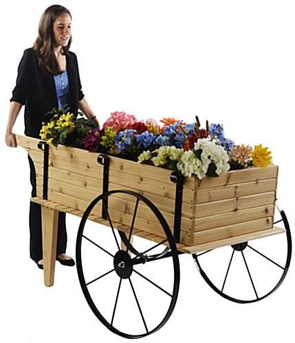 This wooden flower cart is made of quality red cedar. Description from displays2go.ca. I searched for this on bing.com/images Wooden Flower Cart, Wheelbarrow Planter, Wood Wagon, Wooden Cart, Outdoor Cart, Wheel Barrow, Wooden Wagon, Garden Cart, Diy Bird Feeder