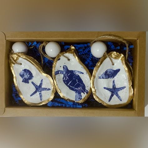 Set Of 3 Handmade Decoupage Coastal Oyster Shell Ornaments Trimmed In Gold Leaf Paint And Sealed. Boxed And Ready To Go! It’s Never Too Early To Get Ready For The Holidays And These Make A Great Gift! #Oystershell #Coastaldecor #Shellart #Wrightsvillebeach #Handmade #Ornaments Decoupage Shell Ornaments, Oyster Shell Decoupage, Painting Oyster Shells Diy, Painted Oysters, Oyster Wreath, Oyster Shell Garland, Christmas Shells, Oyster Shells Diy, Oyster Shell Ornaments