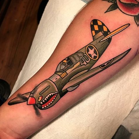 fighter plane tattoo by dave wah at stay humble tattoo company in baltimore maryland the best tattoo shop and artist in baltimore maryland Traditional Fighter Plane Tattoo, Air Force Traditional Tattoo, Spitfire Plane Tattoo, Warplane Tattoo, American Traditional Plane Tattoo, Old School Plane Tattoo, Traditional Plane Tattoo, Aviation Tattoo Pilots, Fighter Plane Tattoo