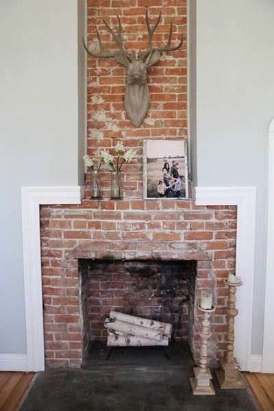 The sitting room is also home to one of the farmhouse's many showstoppers—this floor-to-ceiling brick fireplace that's beautiful in its rustic simplicity. Farmhouse Fireplace Mantel, Exposed Brick Fireplaces, Gaines Fixer Upper, Farmhouse Decor Joanna Gaines, Joanna Gaines Farmhouse, Gaines Farmhouse, Magnolia Fixer Upper, Farmhouse Paint Colors, Farmhouse Paint