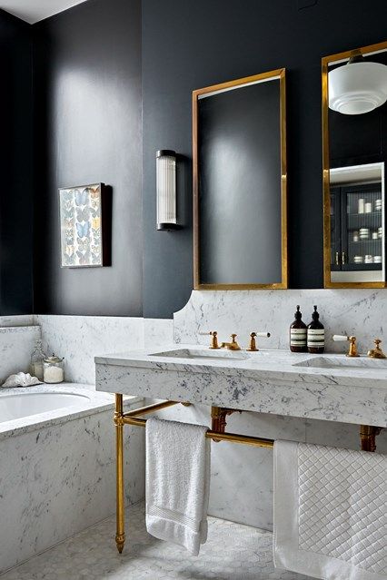 An extremely chic bathroom by Hackett Holland. Get the look: http://h.ouse.co/scmf/OrMCe04Lcp0lODnIfkQ5qBMK2E59OkdLEAk6T5m-Oqhv6j83eDk7LhUOQkoGRZPJJfu2r5of5VHHupa_BGwtnYdYbFp2C3Kd/XDnlTz Masculine Bathroom, Marble Bathroom Designs, Bathroom Suite, 아파트 인테리어, Chic Bathrooms, Marble Bathroom, Counter Tops, Black Bathroom, Beautiful Bathrooms