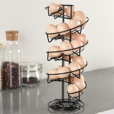 This egg spiral rack adopts roller storage in helter skelter design, make your eggs easy to hand. Remember to always take eggs from the bottom and it will ensure the earliest eggs get used first. Rotates 360 degree and new spiraling design with non-slip fine felt base. It can holds 3 dozen eggs. Rotating rack allows you to easily access to different eggs. New compact design for decorative and indoor use, ideal for storing eggs neatly within your kitchen; keeps all eggs in sight & work surfaces c Egg Skelter, Storing Eggs, Lid Organizer, Egg Storage, Door Organizer, Rack Storage, Storage Display, Kitchen Cabinet Storage, Egg Holder