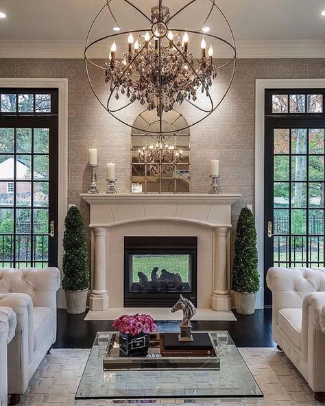 Fireplace mantel with big glass doors and windows on each side #fireplacemantel #fireplace #mantel #homedecor #decorhomeideas Oversized Chandelier, Formal Living Room Decor, Furnitur Ruang Keluarga, Popular Living Room, Trendy Living Rooms, Hus Inspiration, Beautiful Living Rooms, Cool Ideas, Wallpaper Living Room