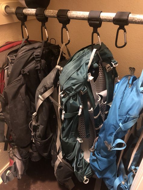 Use stroller keepers with heavy Velcro and carabiner clips to make backpack storage neat and tidy in a closet. No need for hooks that are stationary, or hangers that will break. Backpack Storage Bedroom, Camping Closet Organization, Backpacking Storage Ideas, Hiking Gear Storage Wall, Hiking Gear Closet, Hiking Gear Organization Ideas, Closet Gear Storage, Small Slanted Closet Organization, Rucksack Storage Ideas