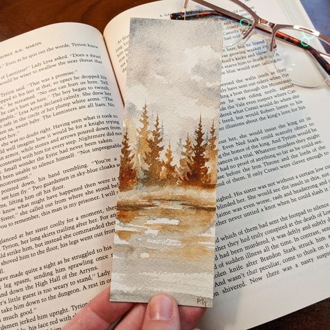 Be greeted by this moody foggy lake watercolor bookmark whenever you open your book! This bookmark is 100% hand painted by me on professional grade watercolor paper and professional paints to ensure your bookmark lasts for years to come! It is double sided and comes with a cute line and dot print on the back! This bookmark will come with a protective vinyl sleeve to ensure both your book and the painting remain safe! *Colors may vary from screen to screen* *Did you know Etsy compresses preview i Watercolor Autumn Painting, Autumn Watercolor Bookmark, Simple Fall Watercolor Paintings, Fall Watercolor Bookmarks, Christmas Bookmarks Watercolor, Watercolor Art Bookmarks, Watercolor Bookmarks Ideas, Basic Watercolor Painting, Fall Watercolor Paintings