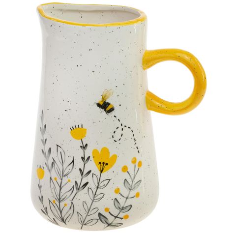 PRICES MAY VARY. SERVING PITCHER Food safe ceramic pitcher adds charm to the table; use for beverage service, as a napkin/utensil caddy, or for displaying fresh or dried flowers HOLDS 8.5 CUPS Measures 7.5 x 5.5 x 8.75 inches, dishwasher and microwave safe SUNNY BEE White pitcher with speckled finish, designed with golden honeycomb and honeybee accents ENTERTAIN IN STYLE Great for serving guests on special occasions, also lovely for the everyday family dining table CELEBRATE THE HOME Coordinate Ceramic Water Pitcher, Pitcher Ideas, Painted Bowls, Pitcher Ceramic, Wholesale Decor, Bee And Flower, Painting Pottery, Family Dining Table, Utensil Caddy