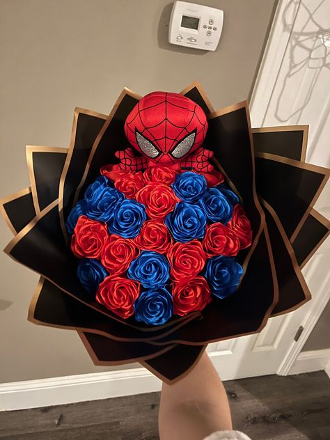 I made this spiderman bouquet for a friend of mine not too long ago, one of my favorite type of bouquets to make :) Please note: orders can take 1 to 2 weeks for production. Spiderman Theme Quinceanera, Spiderman Ribbon Bouquet, Spiderman Flower Bouquet, Spiderman Plushies, Spiderman Quince, Spider Man Things, Spiderman Gifts For Boyfriend, Spider Man Bouquet, Spiderman Birthday Gift